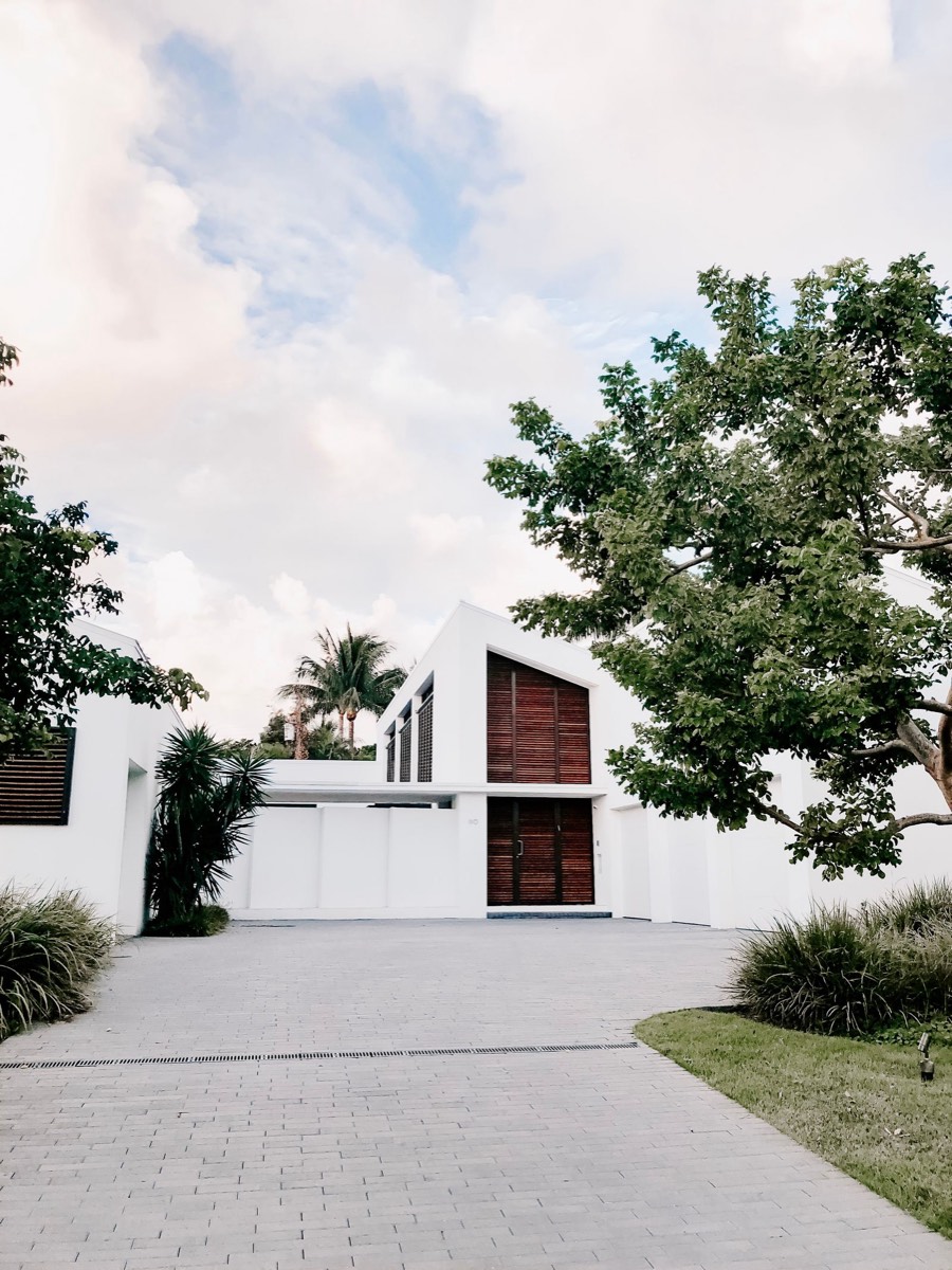 White modern villa framed by palms, Palm Beach